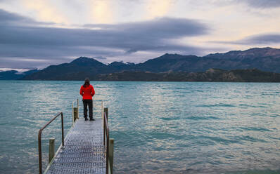 Woman standing on pier at Lago Rio Tranquillo, Carretera Austral, Ayse - CAVF86157