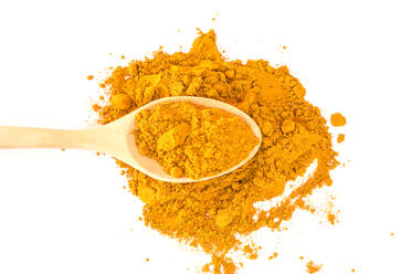 Close-Up Of Ground Turmeric Over White Background - EYF08677