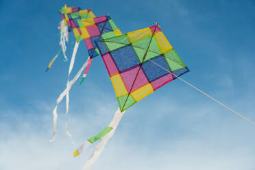 Low Angle View Of Kites Flying Against Sky - EYF08679