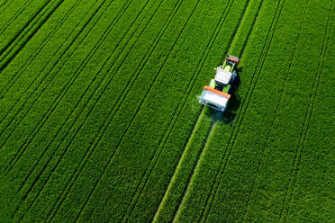High Angle View Of Tractor On Agricultural Field - EYF08815
