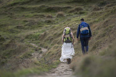 Bridal couple with climbing backpacks at Urkiola mountain, Spain - SNF00414