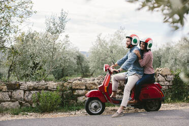 Couple exploring Tuscanyon Vespa, Italy - SODF00774