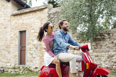 Couple enjoying road trip on Vespa - SODF00785