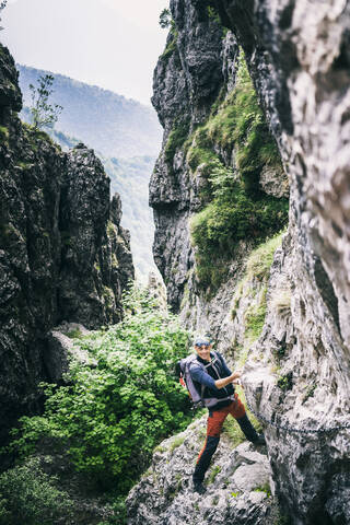 Mountaineer climbing on via ferrata, Orobie, European Alps, Como, Italy stock photo