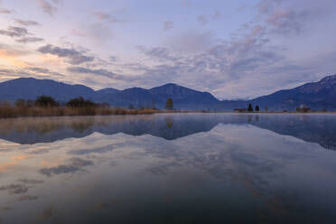 Germany, Bavaria, Schlehdorf, Mountains reflecting in Eichsee at dawn - LBF03092