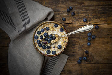Bowl of granola with blueberries and quinoa - LVF08952