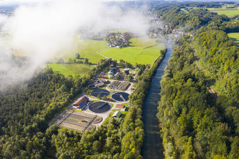 Deutschland, Bayern, Wolfratshausen, Drone view of countryside sewage treatment plant - LHF00795