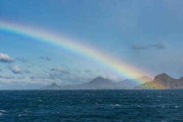 UK, South Georgia and South Sandwich Islands, Rainbow over Atlantic Ocean - RUNF03677