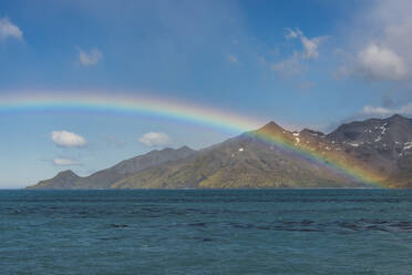 UK, South Georgia and South Sandwich Islands, Rainbow over Atlantic Ocean - RUNF03678