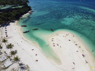 Thailand, Satun Province, Ko Lipe, Aerial view of people relaxing on North Point Beach in summer - RUNF03700