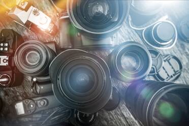 Close-Up Of Cameras On Table - EYF08860