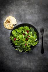 Oriental herb salad (mint, parsley, dill, coriander, lambs lettuce) with currants and pomegranate dressing - LVF08957