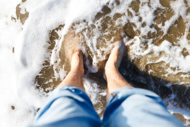 Blond guy tourist in jeans enjoying the beach and the sea - CAVF86529