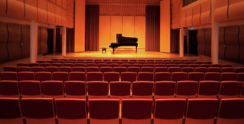 Image of a piano on stage inside an empty concert hall - CAVF86563