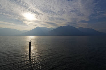 Italy, Lombardy, Sun shining above lake Iseo  - UMF00948