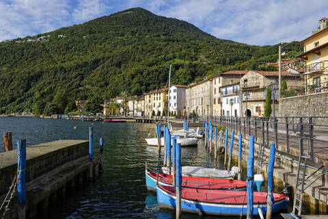 Italy, Lombardy, Riva di Solto, Boat moored on lake Iseo stock photo