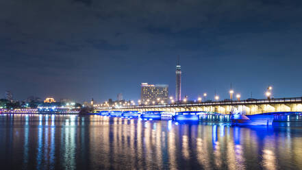 Egypt, Cairo, Nile, Kasr El Nile bridge with El Gezira Cairo Tower at night - TAMF02449