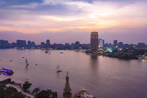 Egypt, Cairo, Nile with skyline and downtown area from Garden City at sunset - TAMF02455