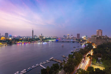 Egypt, Cairo, Nile with Cairo Tower on Gezira Island at dusk - TAMF02456