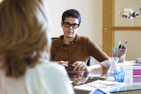 Businesswomen during meeting in office stock photo