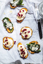 Toasted slices of sweet potatoes with various toppings - SBDF04268