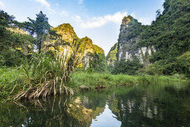 Vietnam, Limestone mountains at Trang An Scenic Landscape Complex - RUNF03737