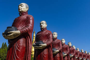 Myanmar, Kachin state, Aung Zay Yan Aung Pagoda, Staues of monks with alms - RUNF03744