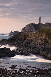 Vertical shot of the Meirás Lighthouse and surrounding cliffs - CAVF86684
