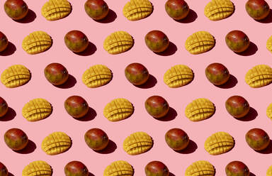 Whole and chopped mango pattern on pink background - GEMF03899