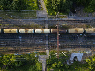 Russia, Leningrad Oblast, Tikhvin, Aerial view of stationary railroad cars - KNTF04799
