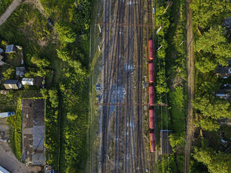 Russia, Leningrad Oblast, Tikhvin, Aerial view of stationary railroad cars - KNTF04800