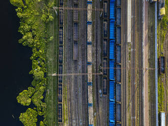 Russia, Leningrad Oblast, Tikhvin, Aerial view of stationary railroad cars - KNTF04801