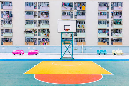 Basketball Hoop Against Buildings In City - EYF09174