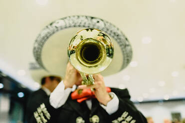 USA, Texas, Young woman playing trumpet stock photo