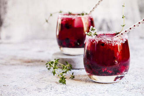 Wild berry thyme smash with wild berries, thyme, tequila, and sparkling water - SBDF04295