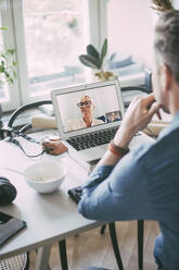 Businesspeople having video conference call working at home - MASF18519