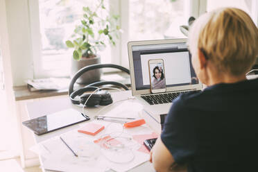 Women workin in office at home having an online meeting - MASF18612