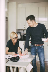 Man and woman having fun working from home - MASF18632