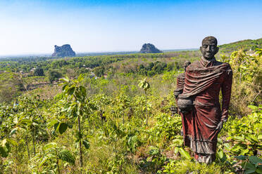 Myanmar, Mon state, outside of Mawlamyine, Buddhist monk statues in field at Win Sein Taw Ya - RUNF03820