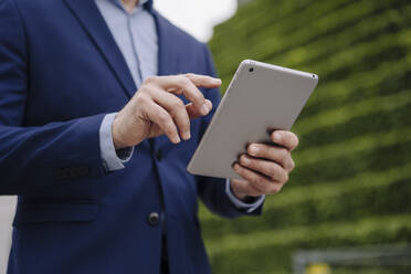 Close-up of businessman using tablet - JOSEF01142