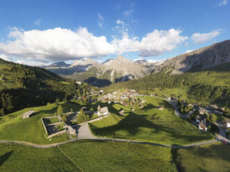 Switzerland, Canton of Grisons, Arosa, Aerial view of mountain resort town in summer - WDF06111