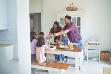 Family eating at dining table - CAIF28229