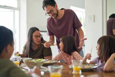 Family eating lunch at dining table - CAIF28268