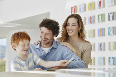 Happy father, mother and son in a villa - RORF02281