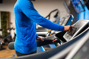 Man jogging on treadmill - ADSF00236