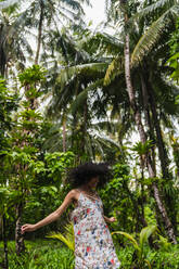Young lady in dress between tropical forest - ADSF00295