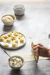 Crop person making natural tortellini - ADSF00320