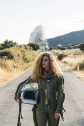 Beautiful woman poses dressed as an astronaut. - ADSF00367