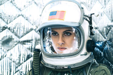 Beautiful woman poses dressed as an astronaut. - ADSF00374