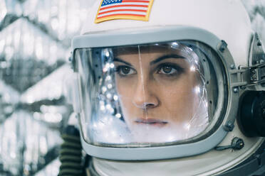 Beautiful woman poses dressed as an astronaut. - ADSF00375